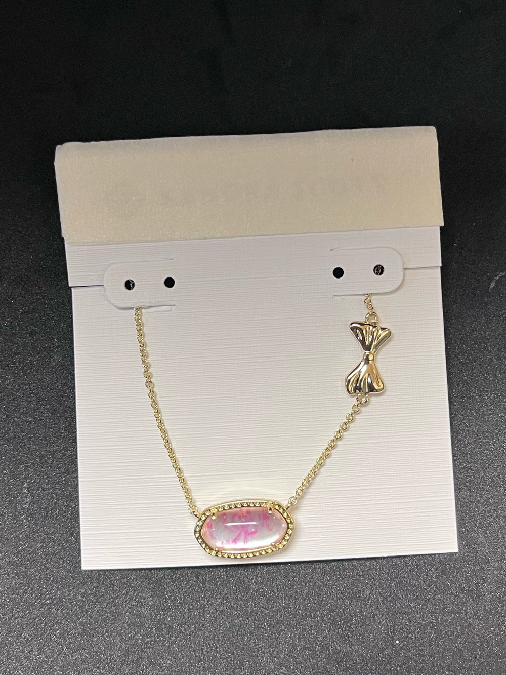 Kendra Scott Gold Necklace with Pink Oval Stone and Bow Charm